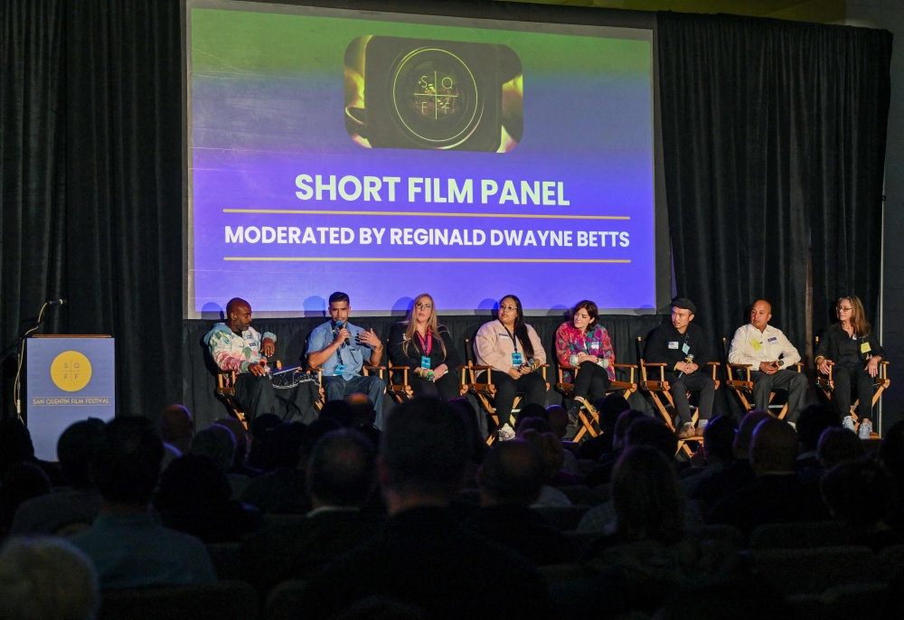 San Quentin immate and filmmaker Ryan Pagan (second left) speaks during a panel lead by US poet and prison reform advocate Reginald Dwayne Betts (L) during the San Quentin Film Festival at San Quentin Rehabilitation Center in San Quentin, California, on October 24, 2025. Held inside a notorious prison among some of California's most violent felons, the San Quentin Film Festival is not your typical Hollywood affair. The festival, launched last year, offers inmates a chance to meet mainstream filmmakers from the outside. — AFP pic