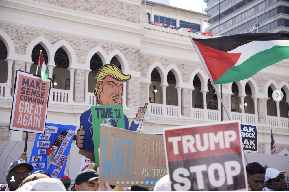Demonstrators at Dataran Merdeka hold up placards and banners condemning US President Donald Trump who made his first official visit to Malaysia for the 47th Asean Summit in Kuala Lumpur on October 26, 2026. — Picture from Instagram/bds_malaysia