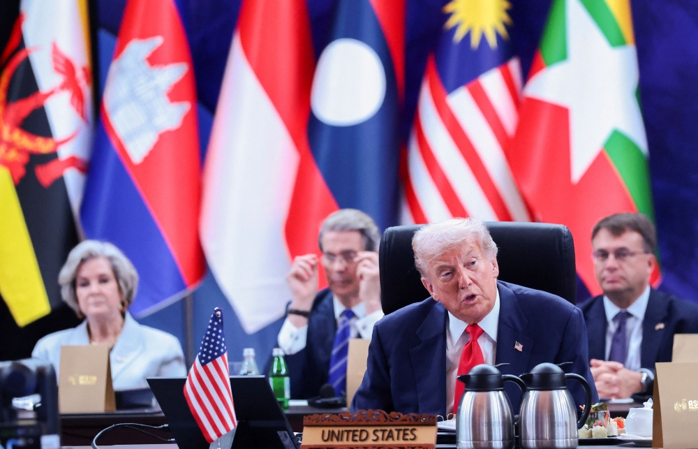 US President Donald Trump speaks as US White House Chief of Staff Susie Wiles, US Treasury Secretary Scott Bessent, and United States Ambassador to Malaysia Edgard D. Kagan look on in the background, at the 47th Association of South-east Asian Nations (Asean) summit in Kuala Lumpur, October 26, 2025. — Reuters pic 