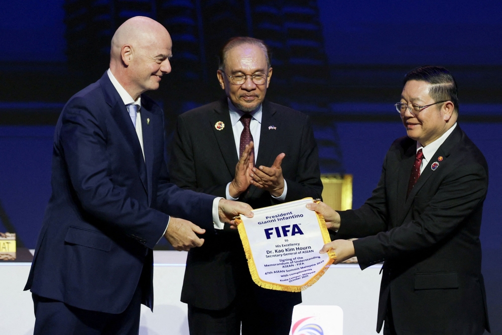 Asean Secretary-General Kao Kim Hourn, Malaysian Prime Minister Datuk Seri Anwar Ibrahim and Fifa chief Gianni Infantino attend a signing ceremony for the Asean-Fifa memorandum of understanding in football development on the sidelines of the 47th Asean Summit in Kuala Lumpur, October 26, 2025. — Reuters pic 