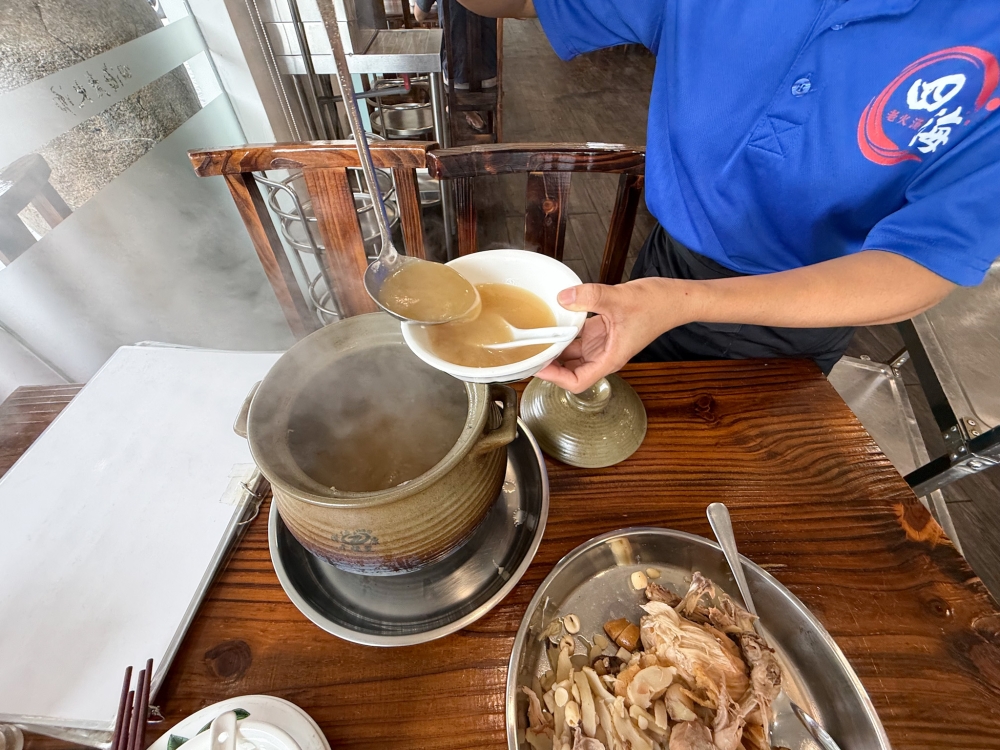 As the liquid is slowly reduced by half, each bowl of golden broth is filled with goodness from the ingredients. — Picture by Lee Khang Yi