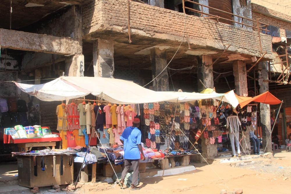 A Sudanese vendor waits by his shop in a market in Omdurman on October 22, 2025. — AFP pic