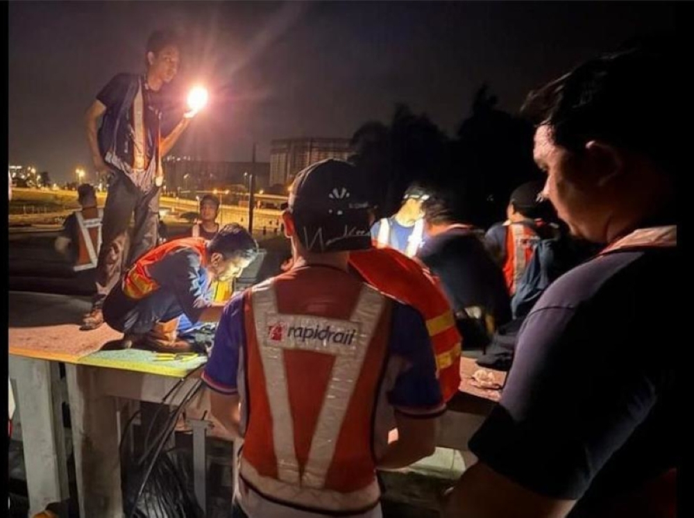 The Rapid Rail technical team, together with the original system experts (OEM) carried out an overnight repair on the Putrajaya Line signaling system. — Picture from Facebook/Rapid KL