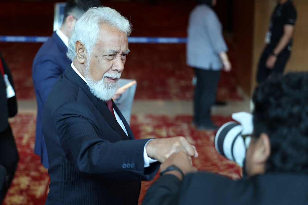While other leaders walked the red carpet with reserved smiles, Xanana Gusmão was seen fist-bumping reporters and photographers covering the Asean Summit. — Reuters pic