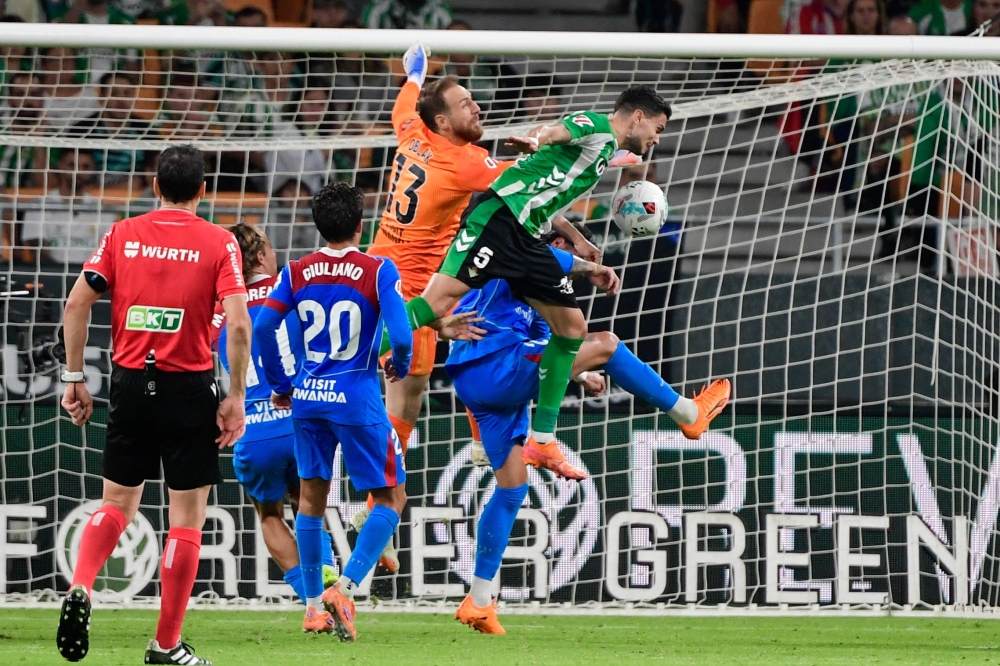 Atletico Madrid earned a solid 2-0 win at Real Betis on Monday to move fourth in La Liga and bounce back from their Champions League thrashing by Arsenal. — AFP pic