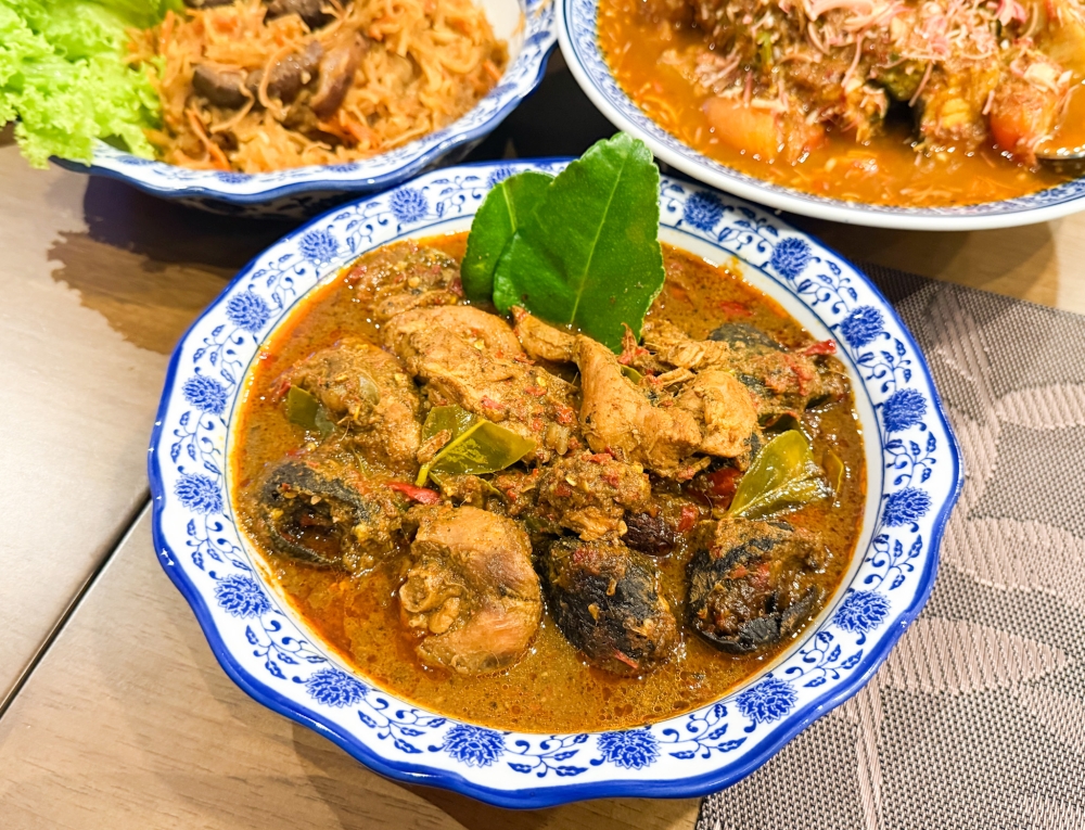 Ayam Buah Keluak is always a big treat especially with the thick curry fragrant with kaffir lime leaves and the earthy paste from the ‘keluak’. — Picture by Lee Khang Yi
