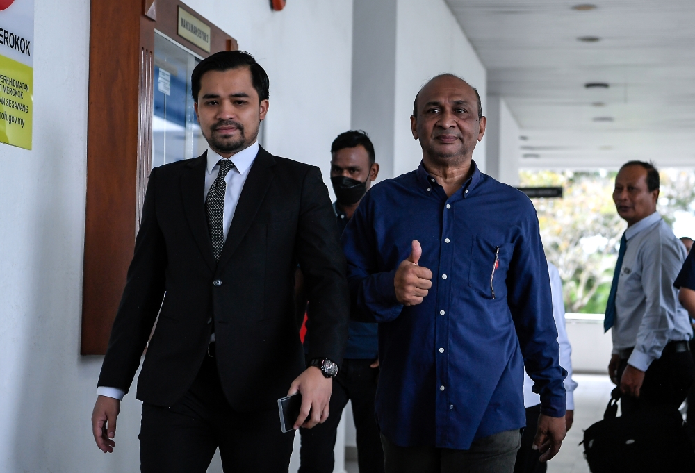 Political activist Zamil Ibrahim (2nd right) and two others pleaded not guilty at the Sessions Court in Alor Setar October 29, 2025, to charges of soliciting and receiving bribes from a celebrity preacher last year. — Bernama pic