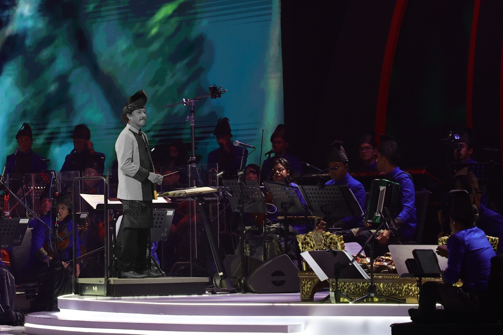 Orkestra Tradisional Malaysia (OTM) Istana Budaya conductor Mohd Yazid Zakaria leads a performance at the Asean Gala Dinner. — Bernama pic 