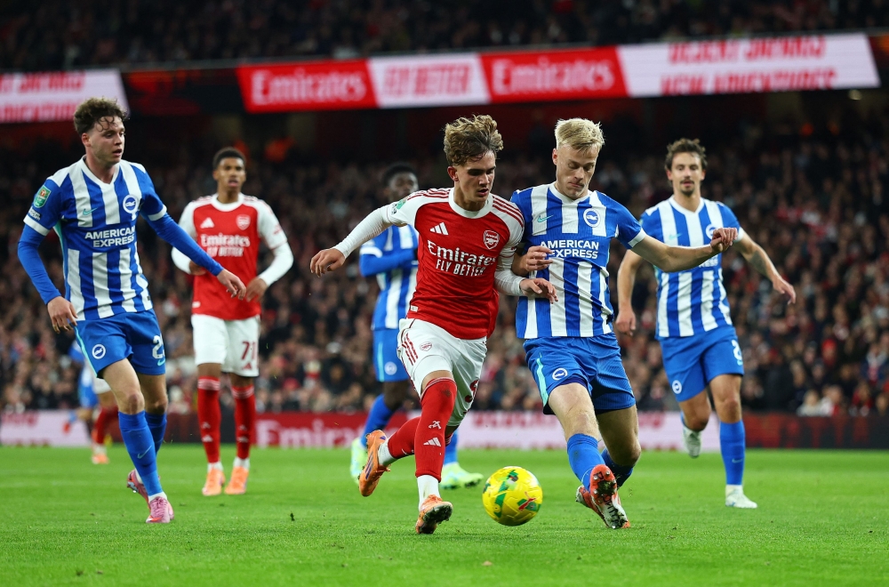 Arsenal’s Max Dowman in action with Brighton & Hove Albion’s Jan Paul van Hecke during their fourth round Carabao Cup match at Emirates Stadium in London October 29, 2025. — Action Images pic via Reuters/Matthew Childs