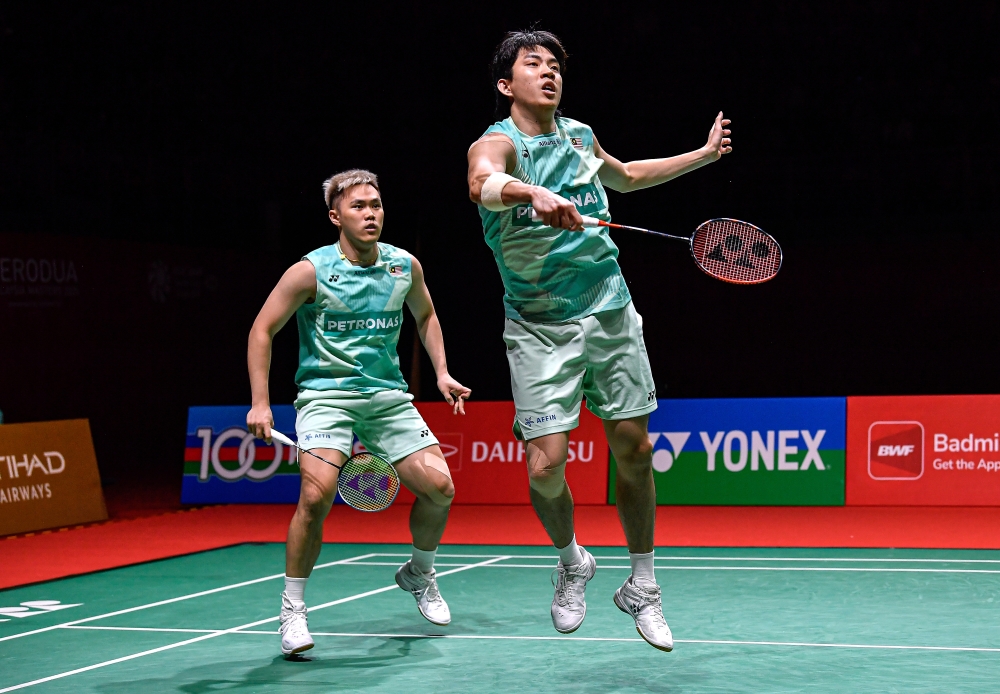 National men’s doubles pair Man Wei Chong-Tee Kai Wun marched into the quarter finals of the Hylo Open after defeating Indonesia pair Bagas Maulana-Leo Rolly Carnando yesterday. — Bernama pic