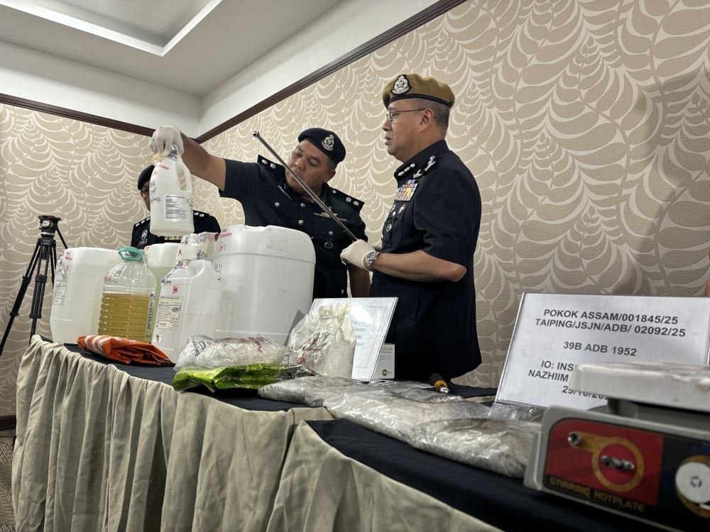 Perak police chief commissioner Datuk Noor Hisam Nordin displays the drugs seized from a meth purification syndicate in Taiping, during a press conference at the Perak Police Headquarters in Ipoh October 31, 2025. — Picture by John Bunyan