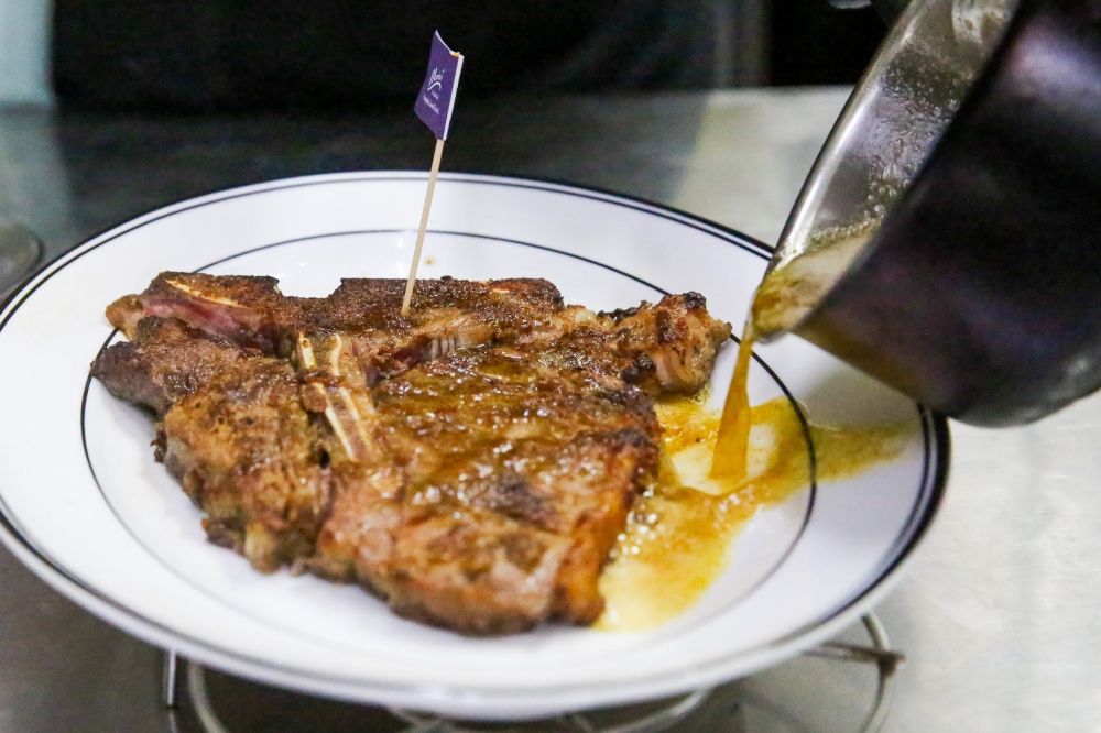 Maria's SteakCafe also has the distinction of serving the unique Sizzling Wagyu Porterhouse with clarified brown butter. — Picture by Choo Choy May
