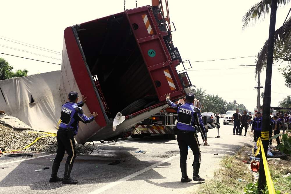 In the accident at 8.54am on May 13, nine FRU members were killed, while nine others were injured after the FRU truck they were travelling in collided with the tipper lorry. — Bernama pic