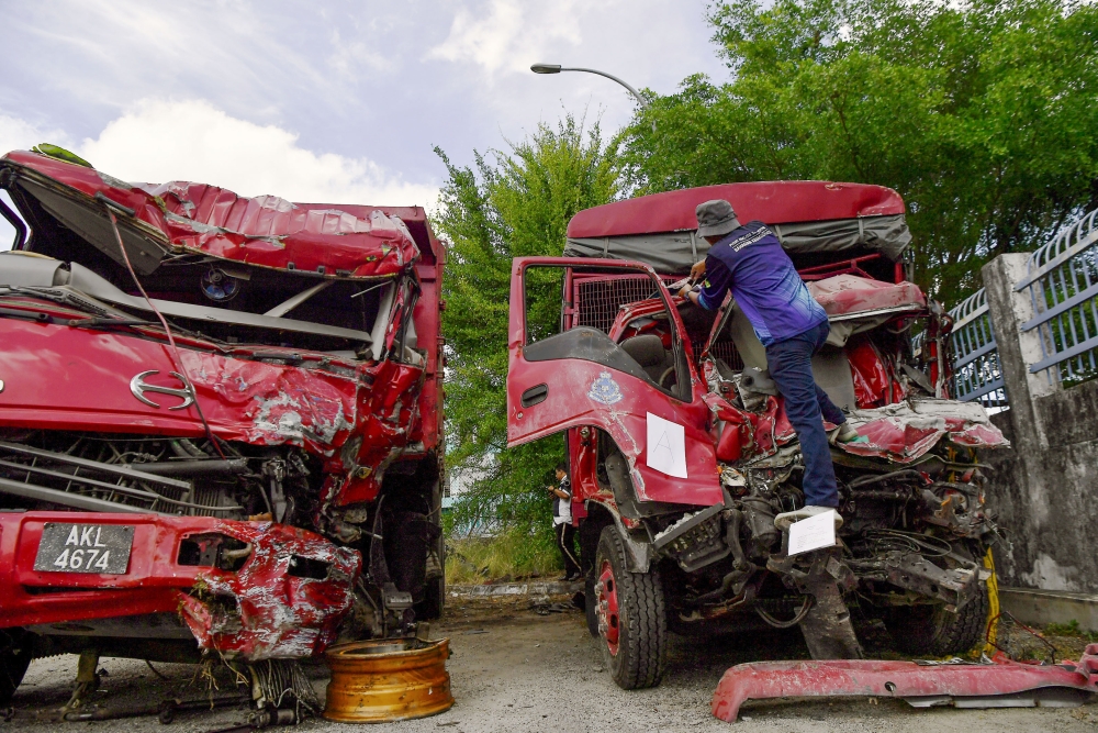 The Transport Ministry’s final report on the Teluk Intan crash that killed nine FRU personnel points to deep-rooted failures in company practices and enforcement oversight, urging reforms in commercial vehicle monitoring. — Bernama pic