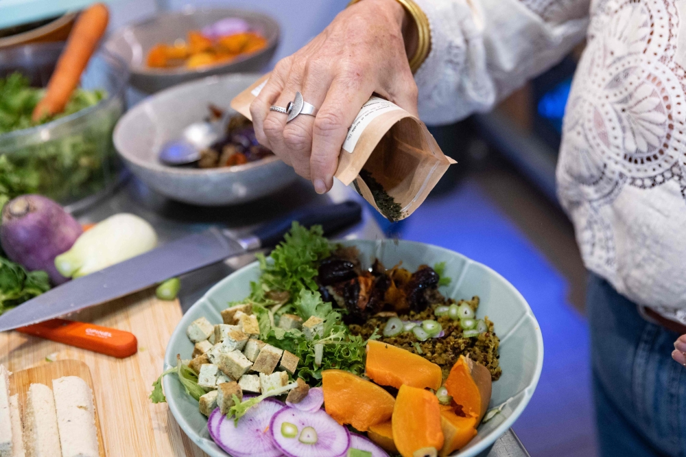 Anne Chassaignon, 63, retired, prepares a vegan meal at her home in Ermenonville, north of Paris, on October 23, 2025. — AFP pic