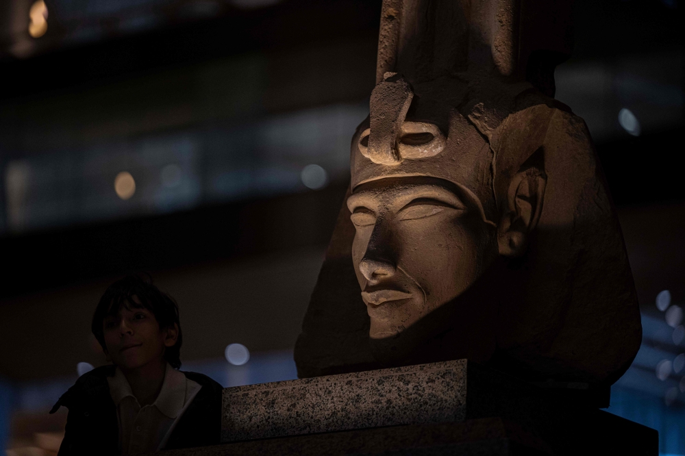 A visitor tours the Grand Egyptian Museum, in Giza on the southwestern outskirts of the capital Cairo on February 7, 2025, set to open fully on July 3, following a partial opening in October. — AFP pic
