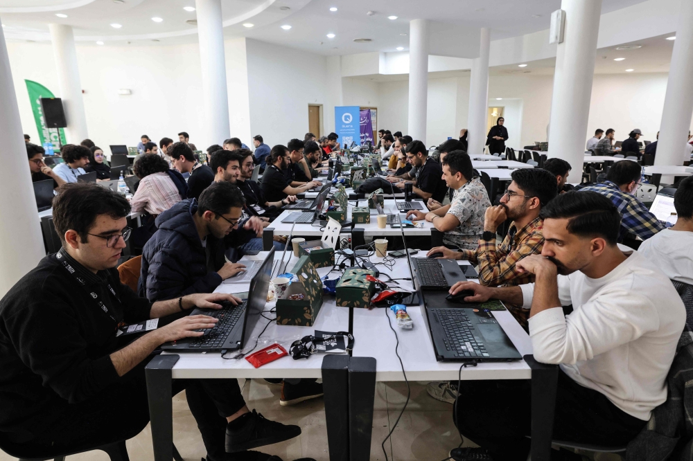 Engineering students work on artificial intelligence projects during the second edition of the International Technology Olympics held at Pardis Technology Park, on the eastern outskirts of Tehran on October 28, 2025. — AFP pic