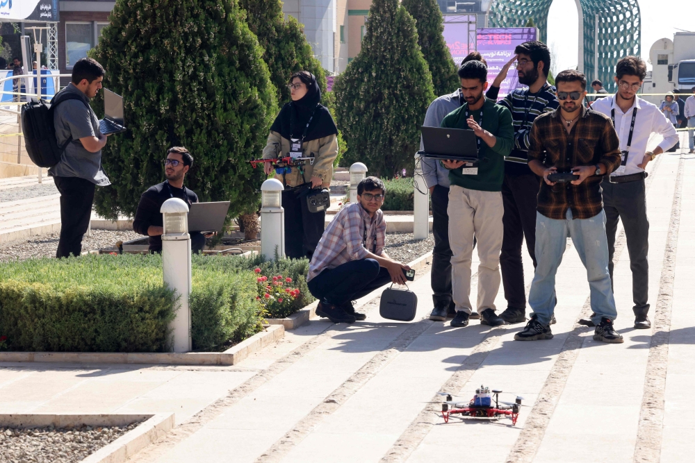 Engineering students conduct drone tests during the second edition of the International Technology Olympics held at Pardis Technology Park, on the eastern outskirts of Tehran on October 28, 2025. — AFP pic