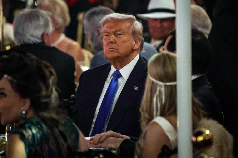 US President Donald Trump talks with guests during a Halloween party at his Mar-a-Lago estate on October 31, 2025 at Palm Beach, Florida. Trump is spending the weekend at his Mar-A-Lago estate in Palm Beach, Florida. — AFP pic 
