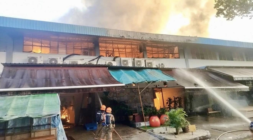 Singapore’s Building and Construction Authority has ordered the closure of a fire-damaged industrial building in Eunos for structural inspections and repair works. — Screengrab via Facebook/Singapore Civil Defence Force