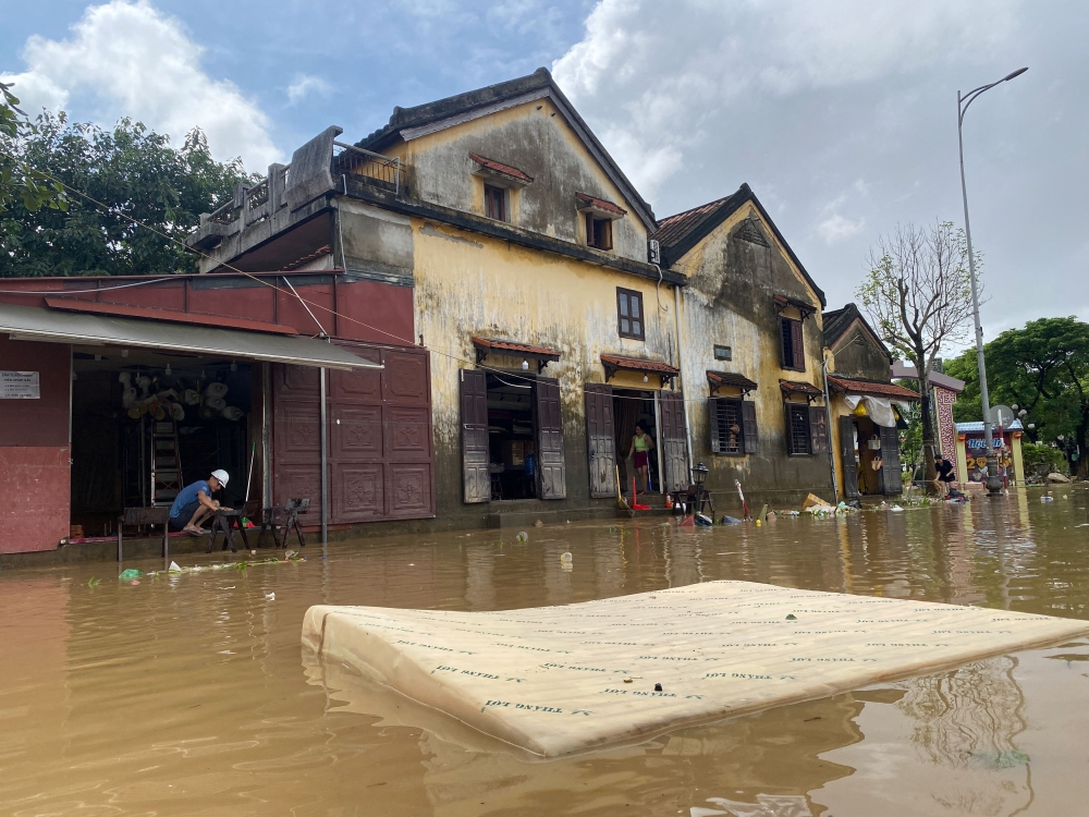 People clean their houses in Hoi An, following deadly floods in central Vietnam, October 31, 2025. — Reuters pic