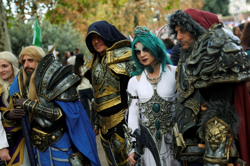 Cosplayers pose in elaborate costumes during the Lucca Comics & Games 2025 event, one of the Europe's largest pop culture conventions, as stars and creators of 'Stranger Things' series launch Season 5, in Lucca, Italy October 31, 2025. — Reuters pic