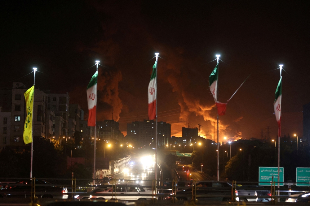 File picture of a fire of Israeli attack on Sharan Oil depot following the Israeli strikes on Iran, in Tehran, Iran, June 15, 2025. — Reuters pic/WANA (West Asia News Agency)/Majid Asgaripour handout