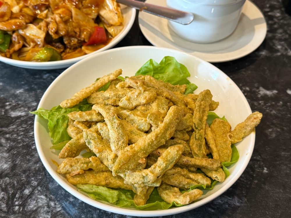 Bitter Gourd with Salted Egg marries greens with a sinful crust of salted egg yolk. — Picture by Lee Khang Yi