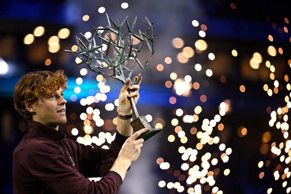 Italy’s Jannik Sinner celebrates with the trophy after winning the men’s singles final match of the Paris ATP Masters 1000 tennis tournament against Canada’s Felix Auger-Aliassime at the Paris La Défense Arena in Nanterre, on the outskirts of Paris, on November 2, 2025. — AFP pic