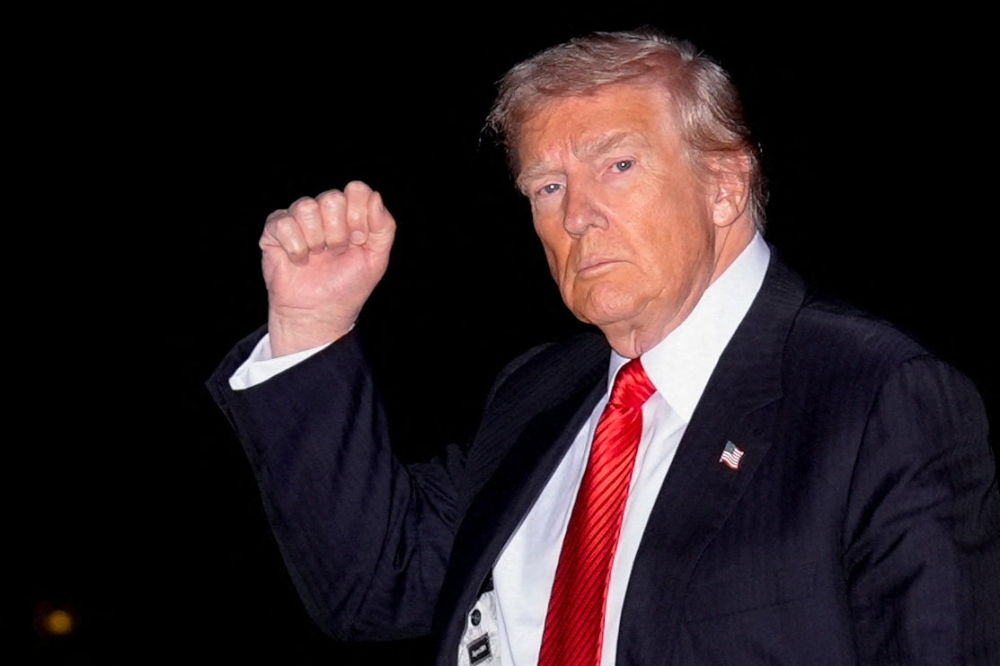 US President Donald Trump gestures as he arrives at the White House following a weekend trip to Florida, in Washington, DC, November 2, 2025. — Reuters pic 