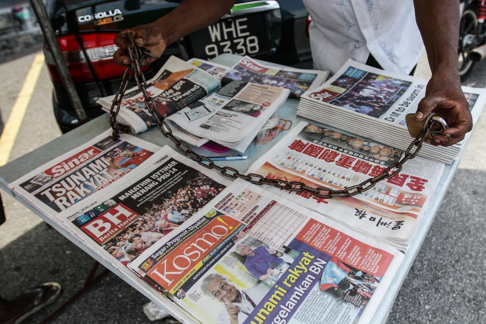 Newspapers are displayed for sale in Puchong, Selangor on May 10, 2018. — Picture by Miera Zulyana