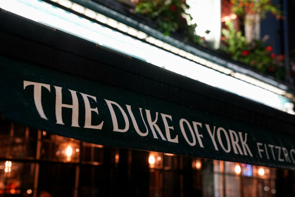 Signage on ‘The Duke of York’ pub, after Buckingham Palace said on Thursday that Britain's King Charles stripped his younger brother Andrew of his title of prince and forced him out of his Windsor home, seeking to distance the royals from him over his links to the Jeffrey Epstein scandal, in London October 31, 2025. — Reuters pic
