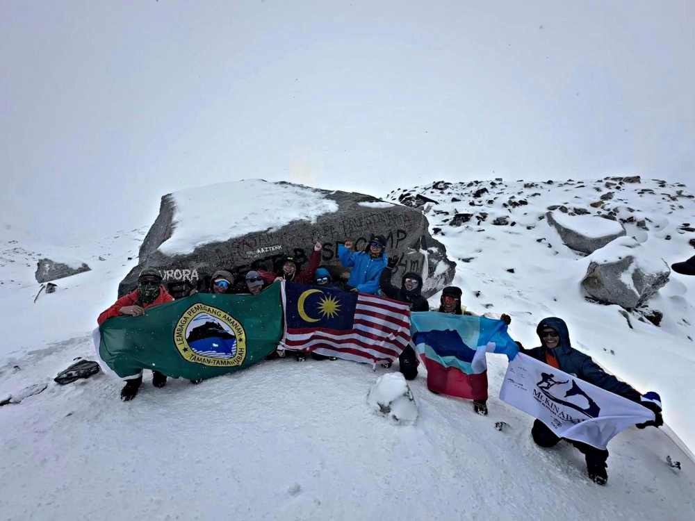 The Sabah Parks team poses for a group photo on Mount Everest in Nepal. — Sabah Parks pic