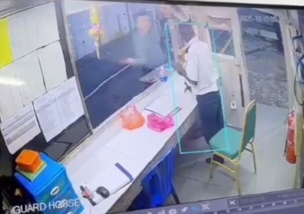 A still from surveillance footage posted online shows the incident involving R. Chandran and a resident from the condominium.