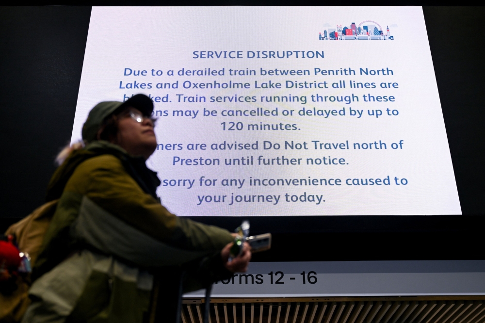 A screen shows information on possible rail service delays and cancellations following a train derailment near Shap in Cumbria, at Euston Station in London November 3, 2025. — Reuters pic 