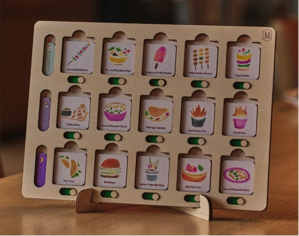 Kids menu featuring artwork by children from KDSF-NC.