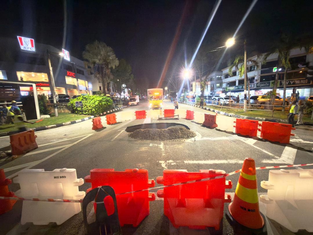 A 5-metre sinkhole formed in front of SMK Sungai Ara in Bayan Lepas, Penang on November 4, 2025. — Picture from Facebook/Zairil Khir Johari