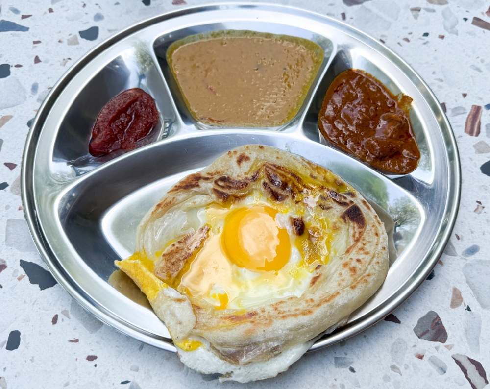 Roti Sarang Burung features a jiggly egg inside a nest of dough. — Picture by Lee Khang Yi