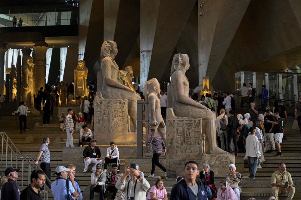 Visitors at the Grand Egyptian Museum near the Giza pyramids in Cairo on November 4, 2025. The billion-dollar museum showcases King Tutankhamun’s 5,000 artefacts, many displayed together for the first time. — AFP pic