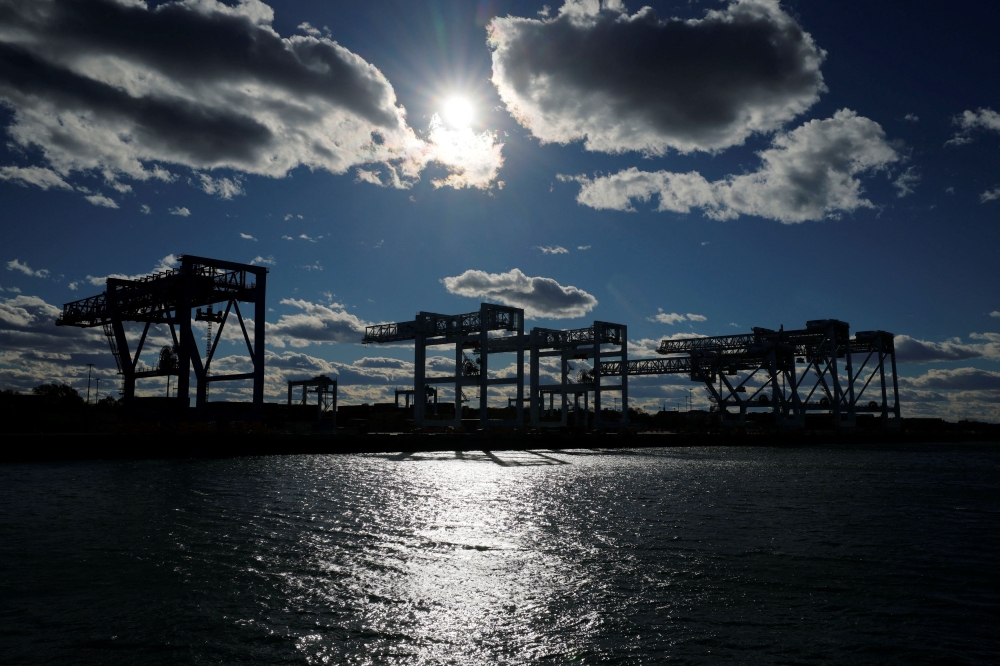 Cranes stand over stacked shipping containers at the Conley Container Terminal, as the US Supreme Court is set to consider the legality of US President Donald Trump’s global tariffs, in Boston, Massachusetts November 4, 2025. — Reuters pic 