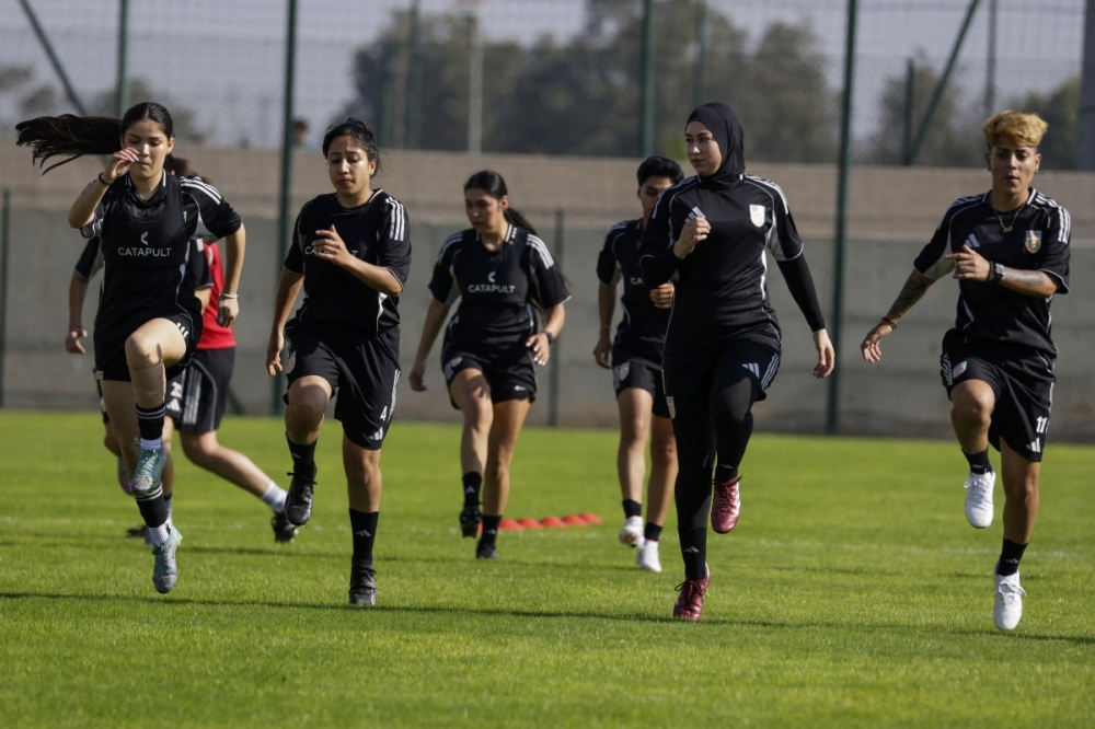 Afghan Women’s United football team players warm up during a training session at Raja Club Athletic Academy (RAC) in Casablanca on October 24, 2025, ahead of the Fifa Unites: Women’s Series 2025. — AFP pic