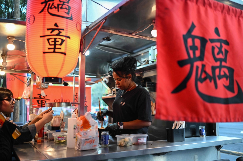 A cook from the Japanese food stall ‘Chido’ prepares ramen, a traditional Japanese noodle dish, in Mexico City on October 29, 2025. — AFP pic 