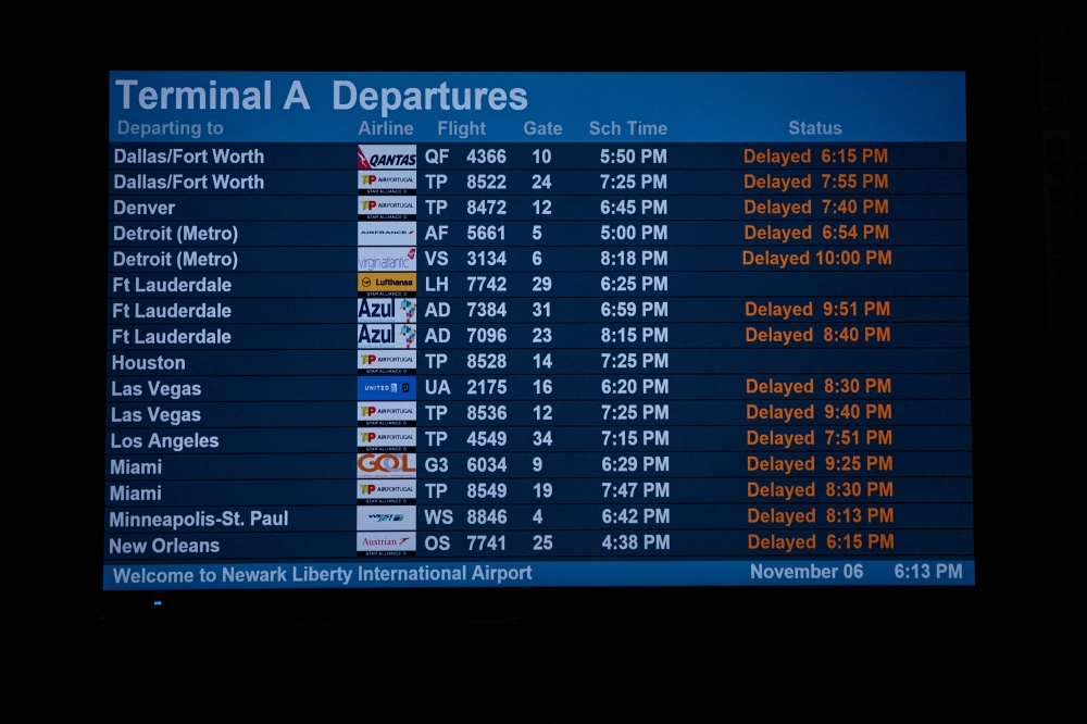 A screen shows delayed flights at Newark Liberty International Airport amid FAA’s 10 per cent flight cut due to the US government shutdown, November 6, 2025. — AFP pic
