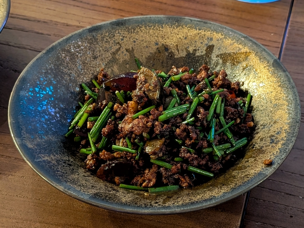 Stir-fried baby chives with century eggs and minced pork is a returning face from Sangong. — Picture by Ethan Lau