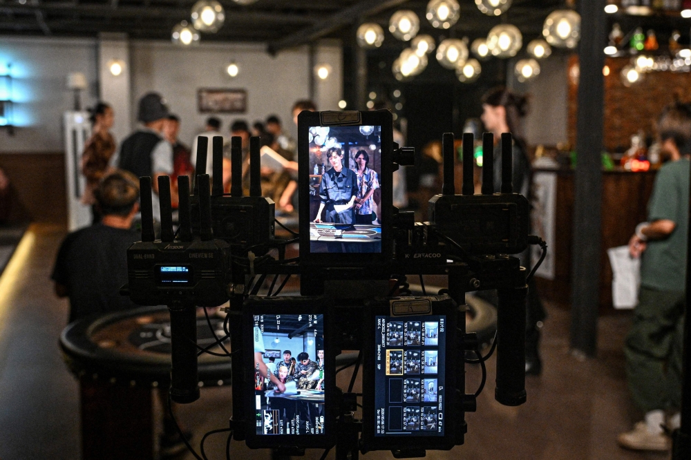 The photo taken on October 10, 2025 shows the monitor screens at a microdrama film studio in Shanghai. — AFP pic