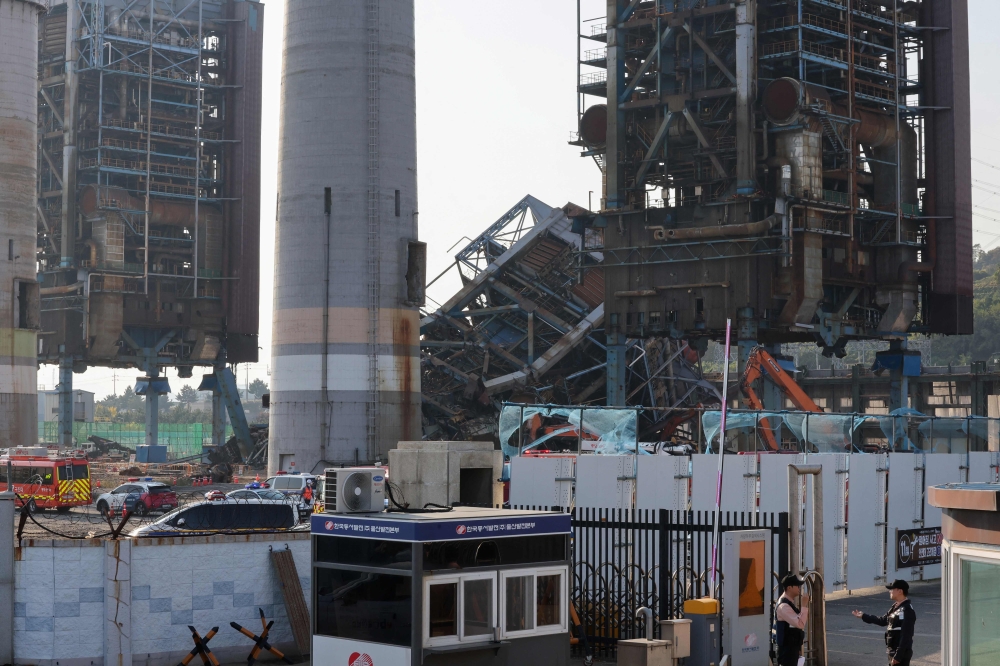 A general view of a 60 meter-high boiler tower (back C) at the Korea East-West Power Corporation after it collapsed in the southeastern city of Ulsan on November 6, 2025. — AFP pic