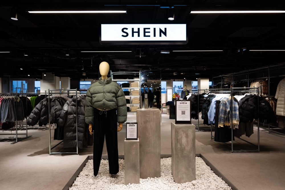 This photograph shows the logo of Asian e-commerce giant Shein in its stall at the Bazar de l'Hotel de Ville (BHV) department store in Paris on November 4, 2025, on the eve of the opening of its first physical store at BHV in Paris. — AFP pic