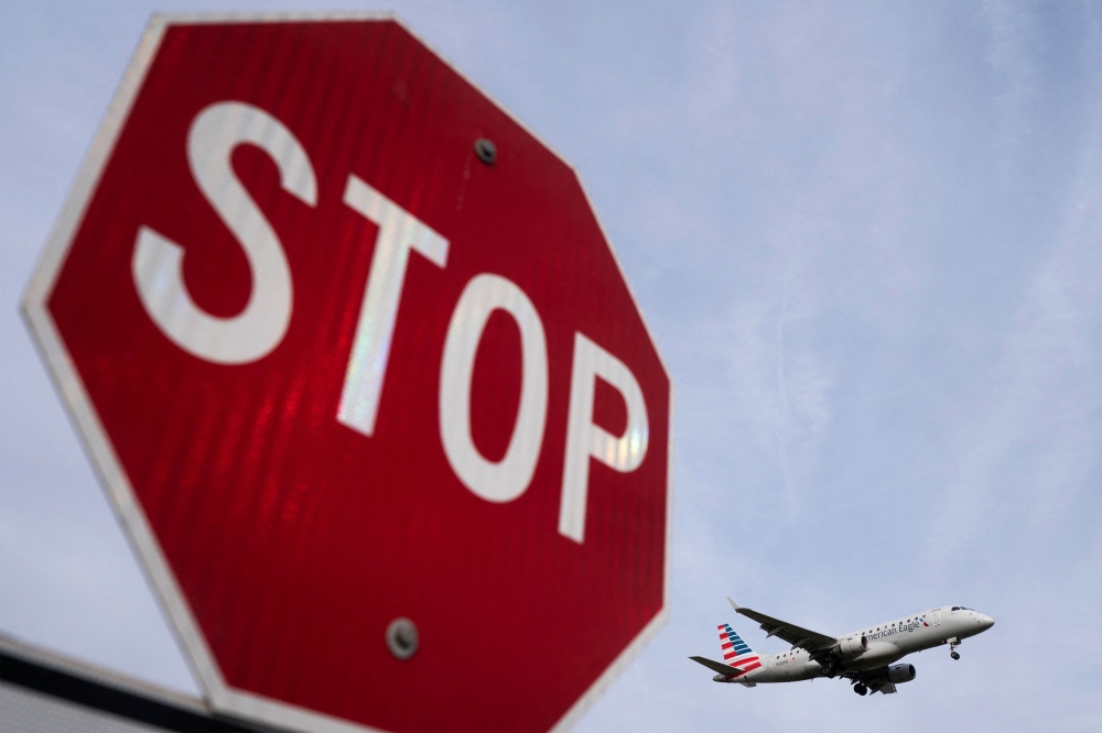 An American Eagle flight lands at Ronald Reagan Washington National Airport as the Trump administration warns of impending cuts to commercial airline operations more than a month into the continuing US government shutdown in Arlington, Virginia November 7, 2025. — Reuters pic
