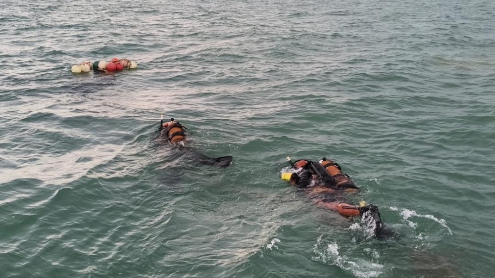 Rescuers combed waters off Tanjung Payung, Niah, for two missing crew members after their fishing boat capsized on Wednesday. Four others were rescued by a passing tugboat. — The Borneo Post pic