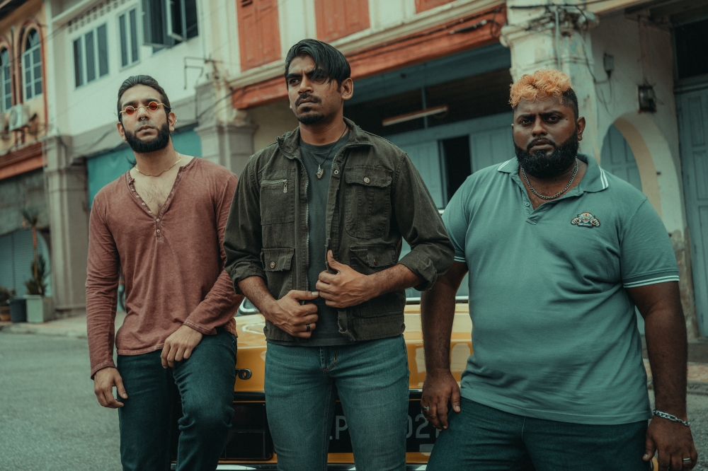 The three leads of Macai, Karnan G. Crak (Middle), Irfan Zaini (Left), and Kuben Mahadevan (Right) —deliver standout performances as Siam, Jack, and Oosi. — Photo courtesy of PoketPlay Films